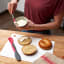 Tovolo Mini Scooper & Spreader - Charcoal and Viva Magenta with bagels