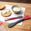 Tovolo Mini Scooper & Spreader - Charcoal and Viva Magenta with bagels