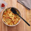 Tovolo Flex-Core All Silicone Spoonula - Black with bowl of pasta