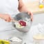 Tovolo Flex-Core Wood Handled Spatula - Cayenne in use