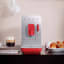 Smeg Bean To Cup Automatic Coffee Machine - Matt Red in use 