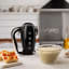 Smeg Retro Style Hand Mixer - Glossy black in use 