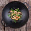 Victoria Matte Black Enamelled Cast Iron Wok with Handles, 36cm in use 