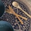 Creative Tops Round Jute Placemats with Mandala Design, Set of 4 in use 