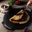Victoria Enamelled Cast Iron Pizza Pan with Helper Handles, 38cm in use