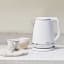 Cuisinart Cordless Kettle, 1.5L - Warm White with a tea cup