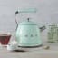 Smeg Whistling Stovetop Kettle - Pastel Green in use