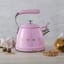 Smeg Whistling Stovetop Kettle - Pastel Pink in use