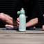 Joseph Joseph Loop Vacuum Insulated Water Bottle, 500ml - Green Product Lifestyle Image