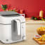 Moulinex Moulinex Uno Access 2.2L Deep Fryer on the kitchen counter with fried chips