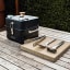 Everdure by Heston Blumenthal Cube360 Charcoal Portable Barbeque on the table with grilling tools