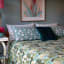 India Ink Aqua Temple Garden Kantha Stitched Throw on the bed