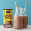 NOMU Reduced Sugar Chocmilk on the table with two bottles
