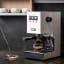 Gaggia Classic Pro Espresso Coffee Machine - White with a cup of espresso coffee