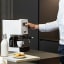 Gaggia Classic Pro Espresso Coffee Machine - White on the kitchen counter with a Gaggia mug