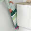 Brabantia Morning Breeze Table Top Ironing Board placing next to the kitchen cupboard