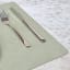 Lind DNA Nupo Leather Square Leather Table Mat - Olive Green on the table with cutlery