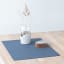 Lind DNA Nupo Leather Square Leather Table Mat - Dark Blue on the table