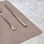 Lind DNA Nupo Leather Square Leather Table Mat - Nomad Grey on the table with cutlery