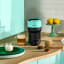 Nespresso Vertuo Pop Coffee Machine - Aqua Mint on the kitchen counter