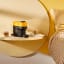 Nespresso Vertuo Pop Coffee Machine - Mango Yellow on the side table in the bedroom