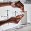 Joseph Joseph Slim Compact Soap Pump in use with soap