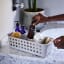 Joseph Joseph EasyStore Slimline Bathroom Storage Basket on counter with products in
