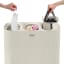 Joseph Joseph Tota Trio 90L Laundry Separation Basket putting a sock in the basket