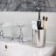 Joseph Joseph EasyStore Luxe Toothbrush Caddy on sink with toothbrushes and toothpaste 