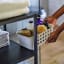 Joseph Joseph EasyStore Medium Bathroom Storage Basket in use on shelf 