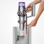 Dyson V11 Absolute Extra Red Cordless Vacuum removing dirt