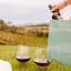 Ngwenya Glass Vulindlela Picnic/Beach Red Wine Glass - Set of 2 in the ground on the lawn at a picnic