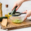 Dreamfarm Fine Ograte Grater, 3mm grating a baby marrow in a bowl