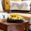 La Porte Blanche Estrella Medium Round Wooden Decorative Bowl on the table with lemons