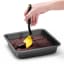 Dreamfarm Mini Chopula Spatula - Yellow lifting the chocolate brownie