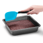 Dreamfarm Mini Chopula Spatula - Blue cutting the chocolate brownie