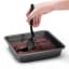 Dreamfarm Mini Chopula Spatula - Black lifting the chocolate brownie