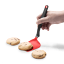 Dreamfarm Mini Chopula Spatula - Red lifting a cookie