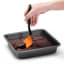 Dreamfarm Mini Chopula Spatula - Orange lifting the chocolate brownie