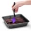 Dreamfarm Mini Chopula Spatula - Purple lifting the chocolate brownie