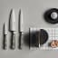 Wusthof Classic Chef's Knife, 20cm - Velvet Oyster on the table with other knives