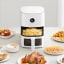 Xiaomi Smart Air Fryer 4L on the table with food