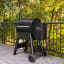 Traeger Pro 575 Wood Pellet Grill next to the balcony rail