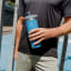 Stanley The IceFlow Flip Straw Vacuum-Insulated Tumbler, 890ml - Azure showing scale in hand