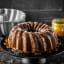 MasterClass Non-Stick Cast Aluminium Decorative Cake Tin, Swirl with the baked cake