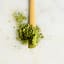 SANA Organic Matcha Green Tea powder with a scoop