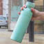 Built Planet Eco Friendly Recycled Water Bottle, 500ml - Green held outdoor