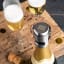 Vacu Vin Stainless Steel Champagne Stopper - Silver on a champagne bottle with champagne glasses