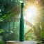 Pomadent Pomabrush Sonic Toothbrush Set - Forest Green on a table in a forest