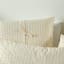 Linen House Ferrara Duvet Cover Set in Sand - King detail on the bed